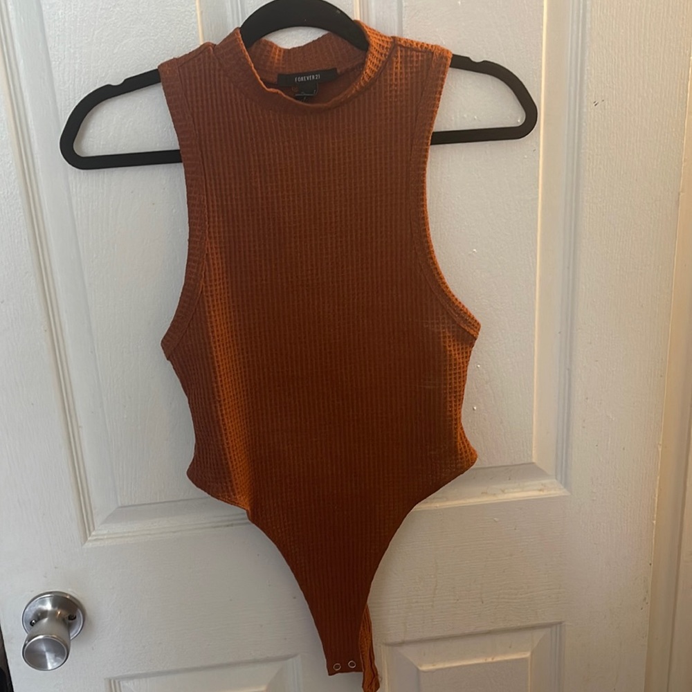 Burnt orange/rust body suit